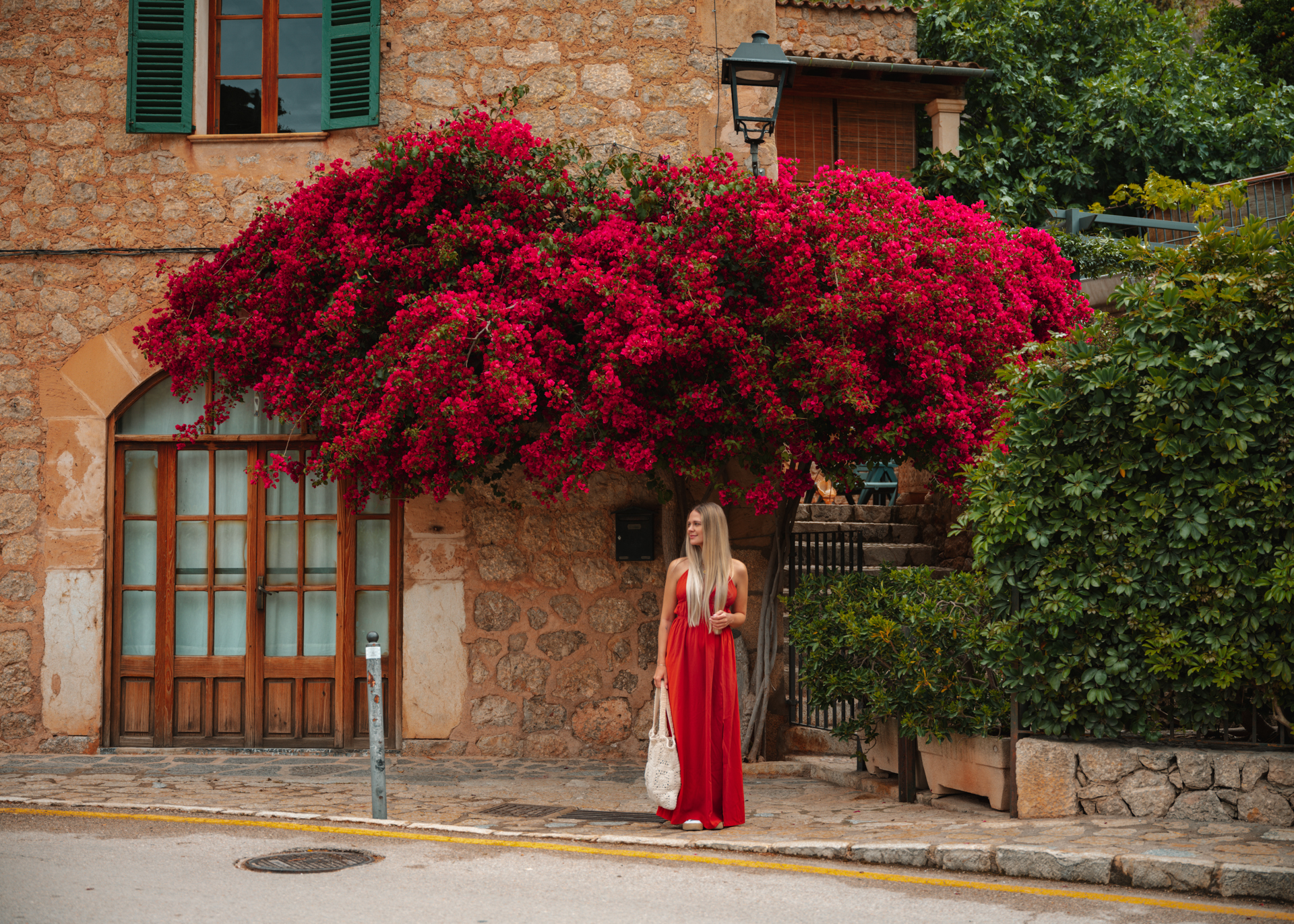 Bougainvillea-covered stone house in Deià, Mallorca