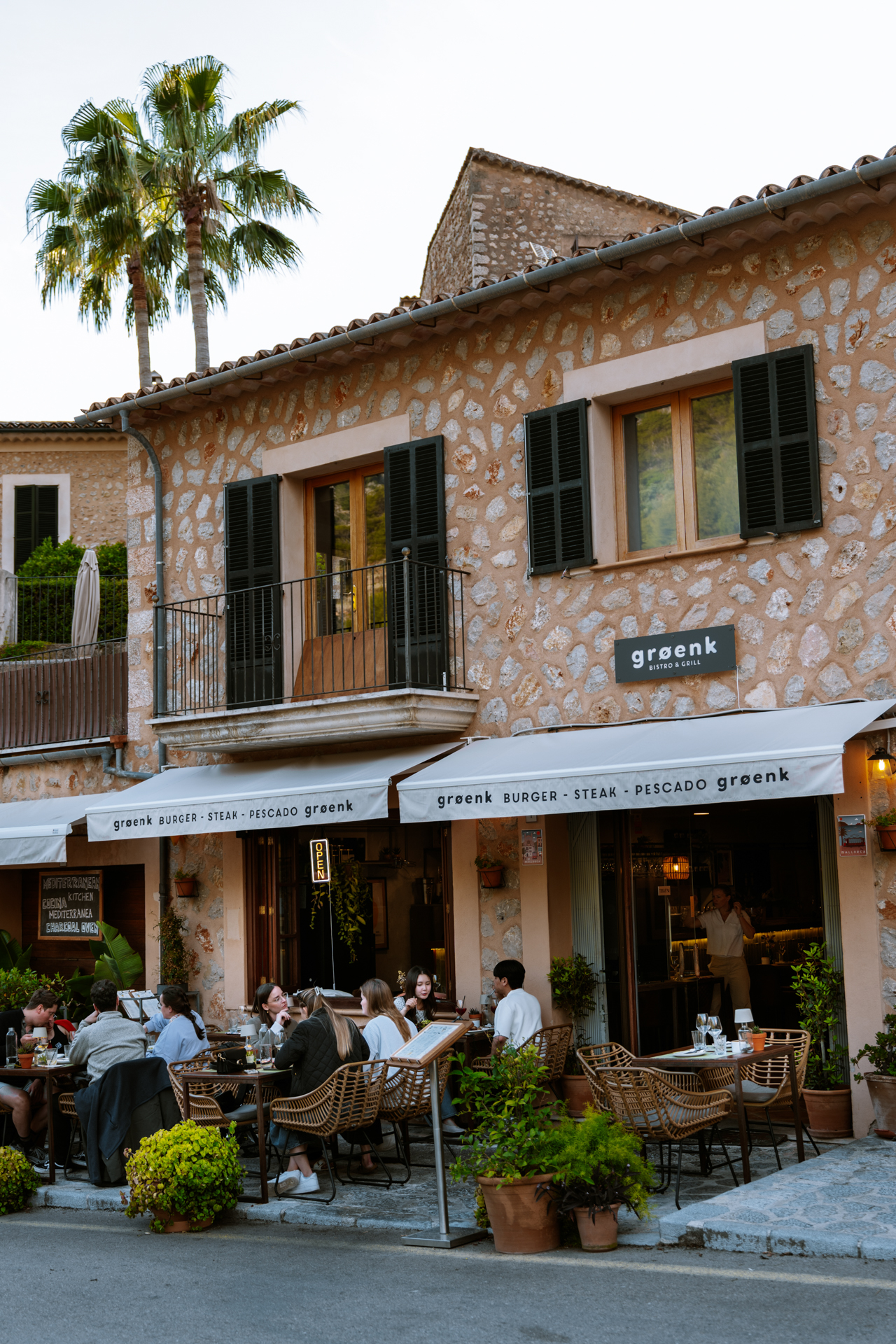 Outdoor dining at a traditional restaurant in Fornalutx, Mallorca, Spain.