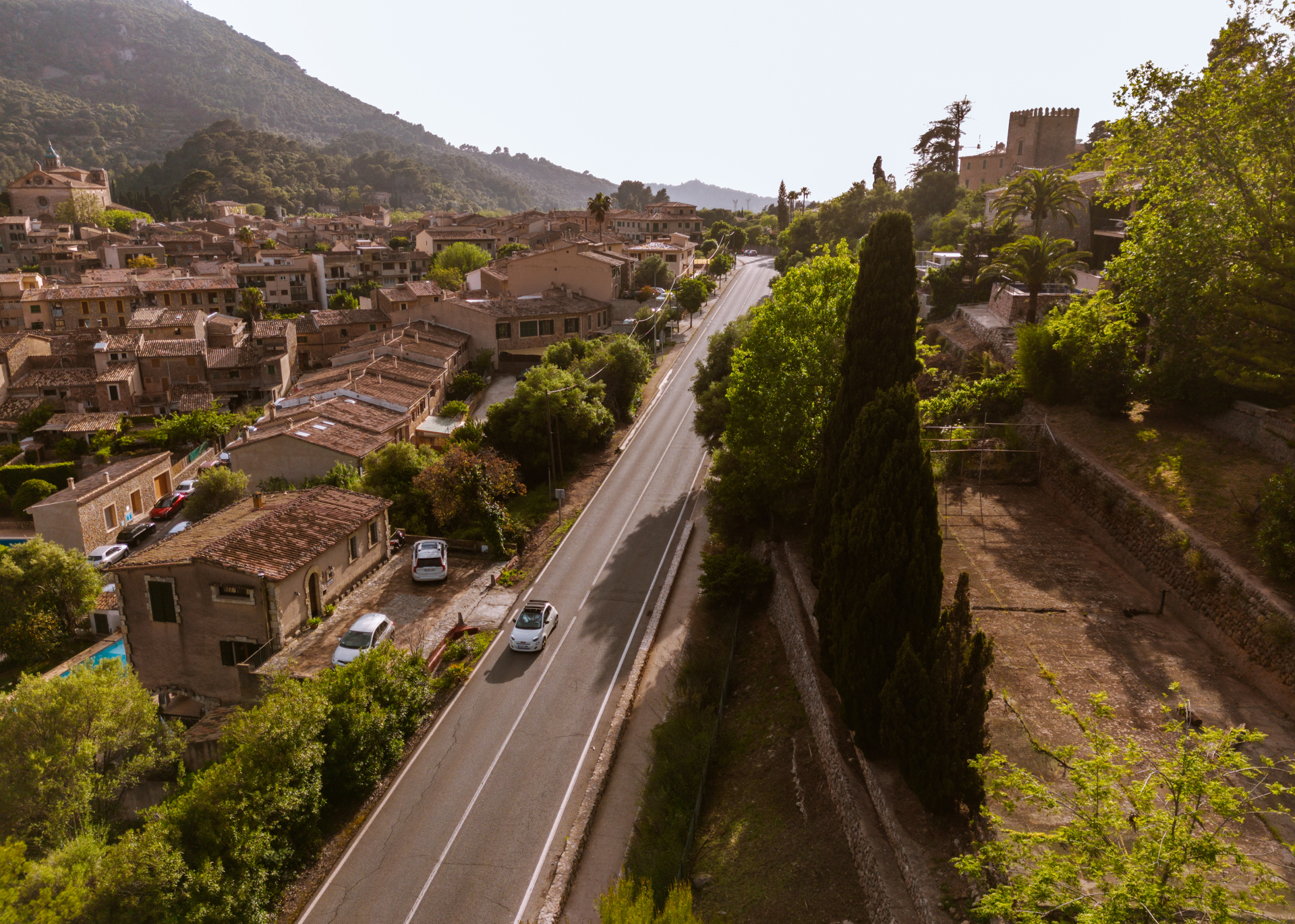 Aerial view of Valldemossa village and scenic mountain road in Mallorca