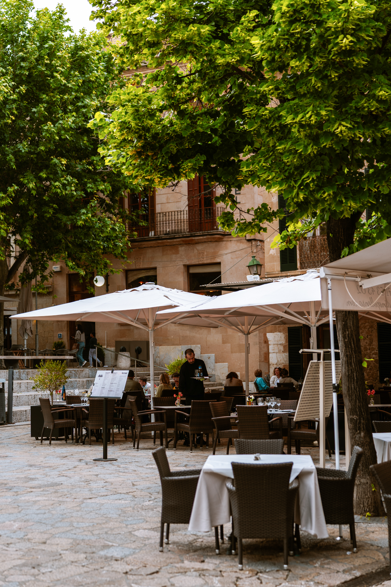 Outdoor restaurants and cafés in Plaça Major, Pollença, Mallorca