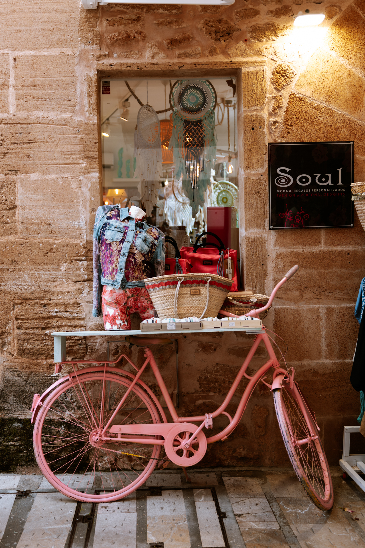 Charming streets and boutique shops in Alcúdia Old Town, Mallorca.