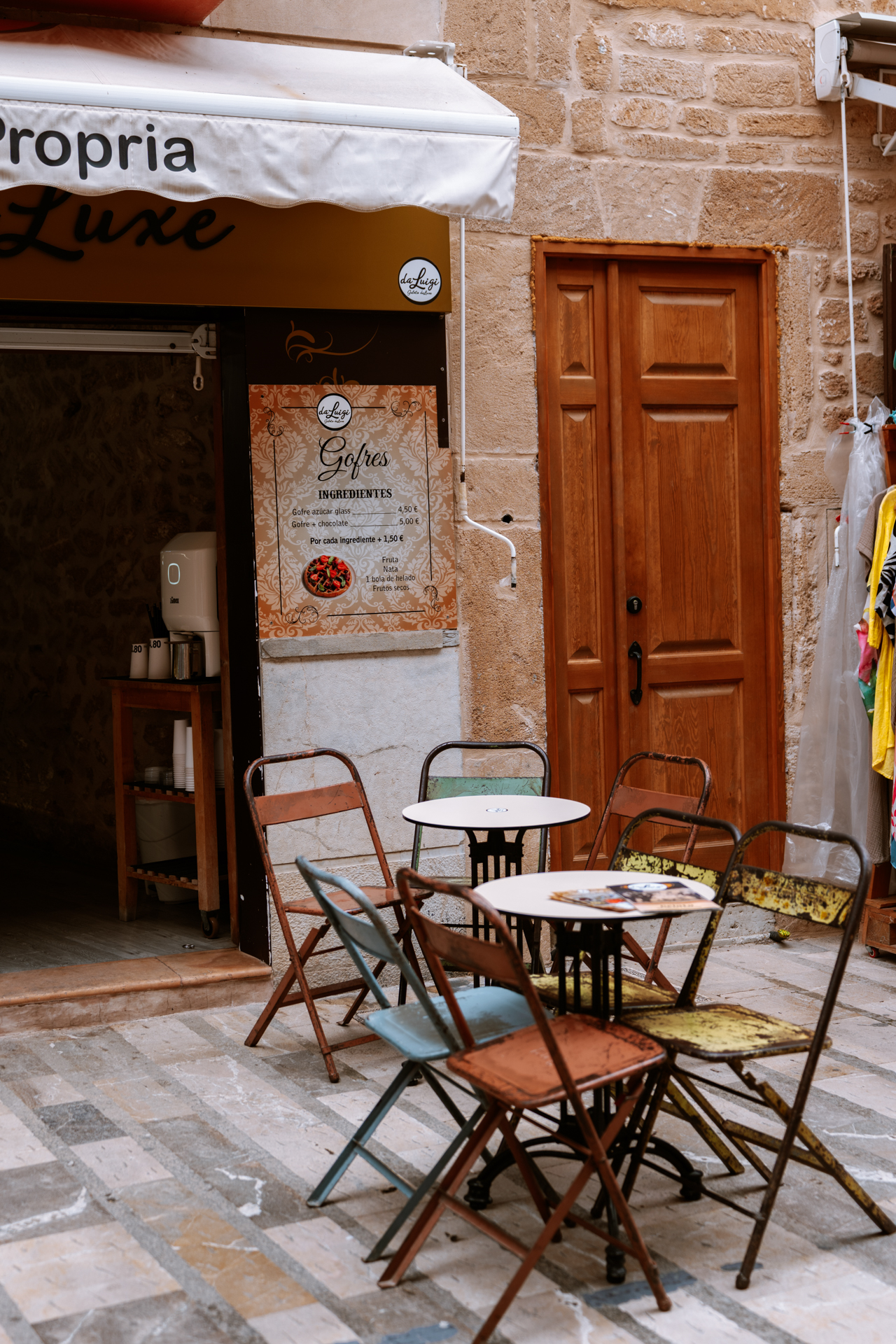 Cozy café table outside an ice cream shop in Alcúdia Old Town, Mallorca.