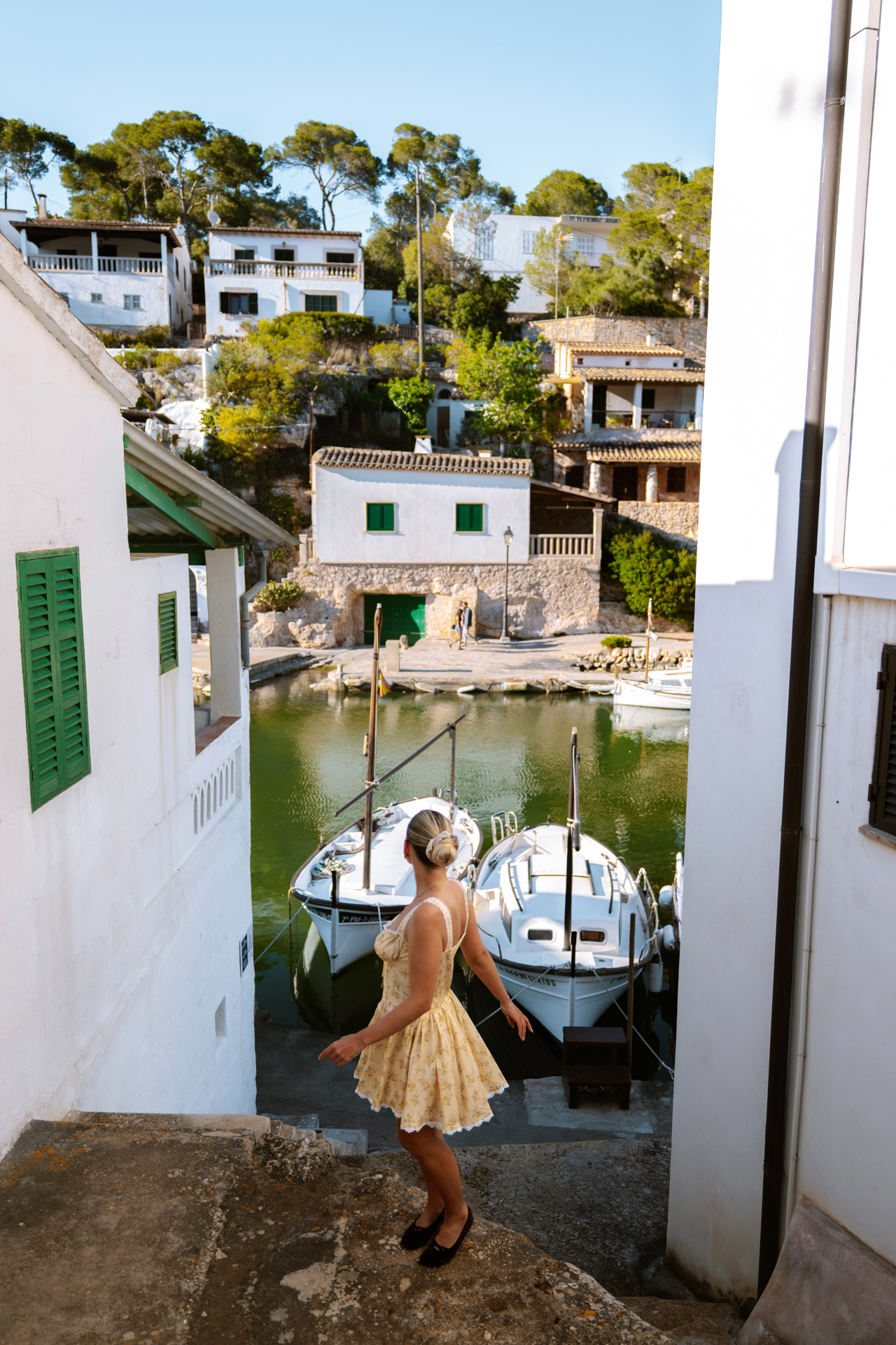 Woman overlooking Cala Figuera harbor, Mallorca