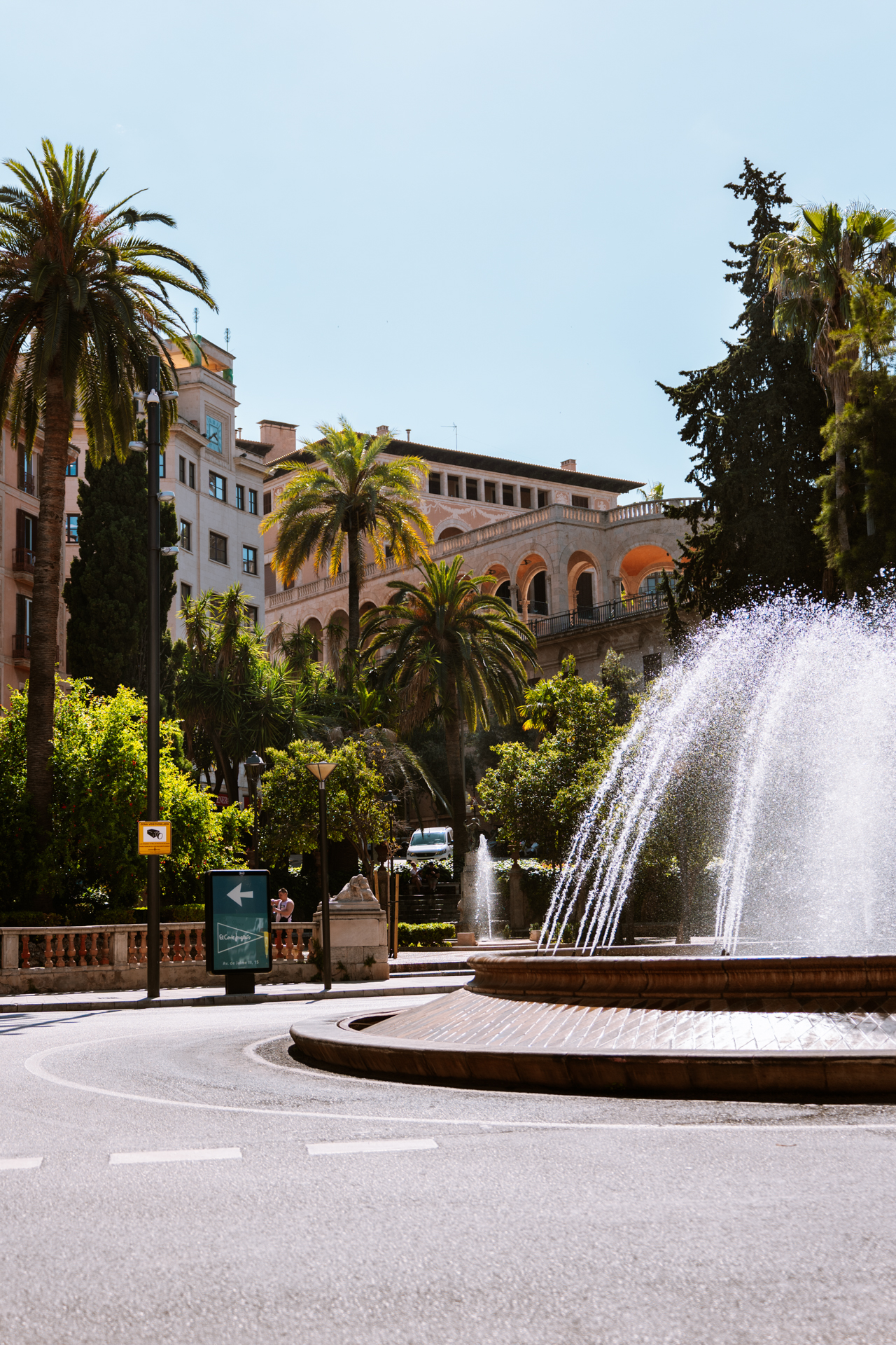 Fountain and palm trees in the heart of Palma de Mallorca, Spain.