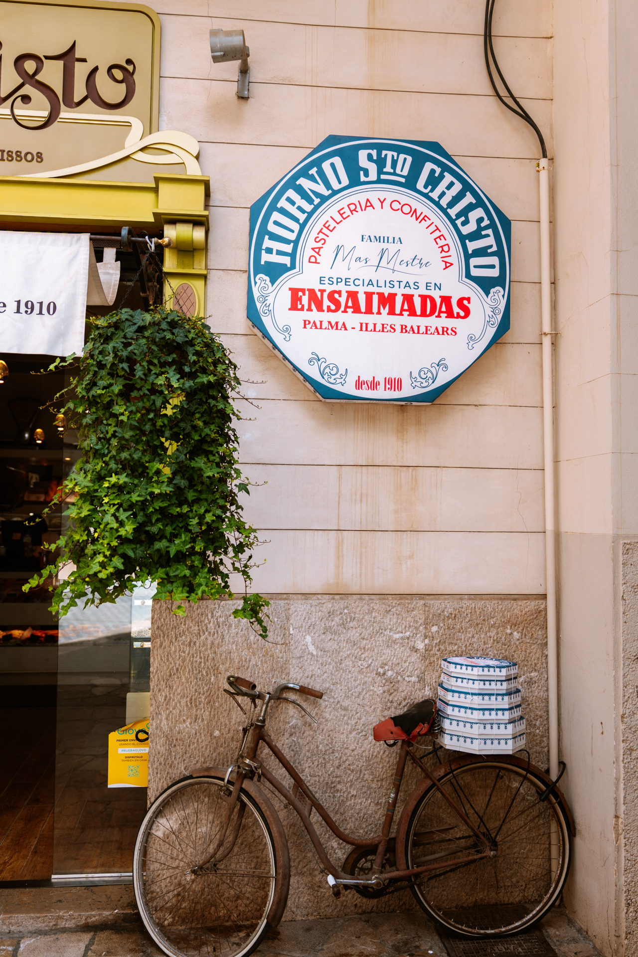 ensaïmada in front of a traditional bakery in Palma de Mallorca, Spain.