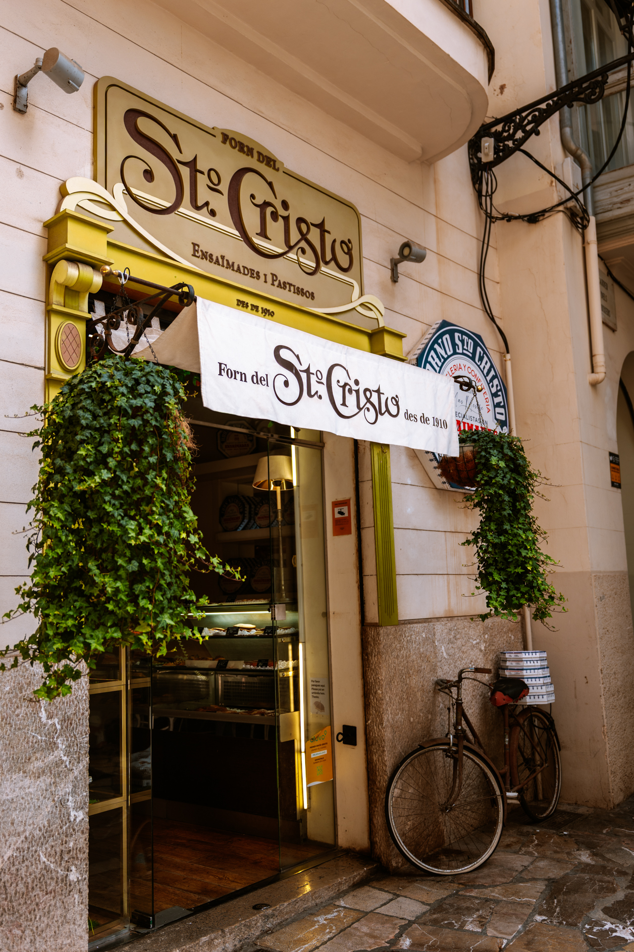 Historic Forn del Santo Cristo bakery entrance in Palma de Mallorca, Spain.