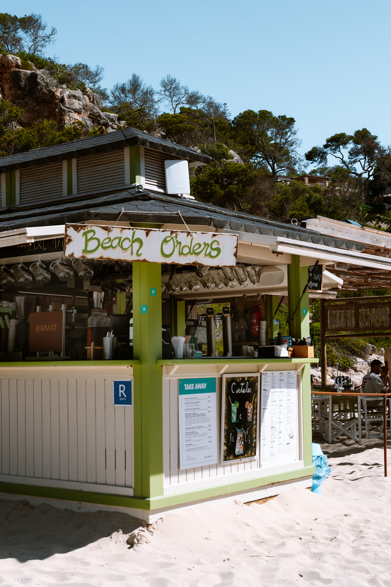 Beach bar and snack kiosk on the sandy beach of Cala Llombards