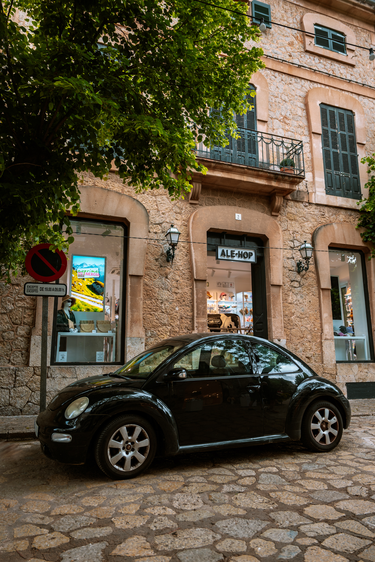 Classic Volkswagen Beetle parked in the center of Valldemossa, Mallorca