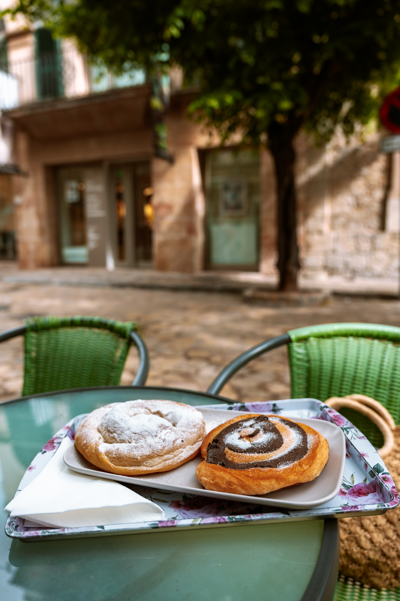 Traditional ensaimada pastries at a café terrace in Mallorca