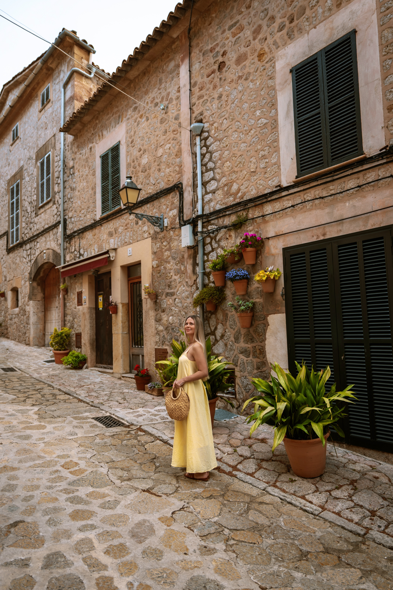 Woman on a picturesque stone street in Valldemossa, Mallorca