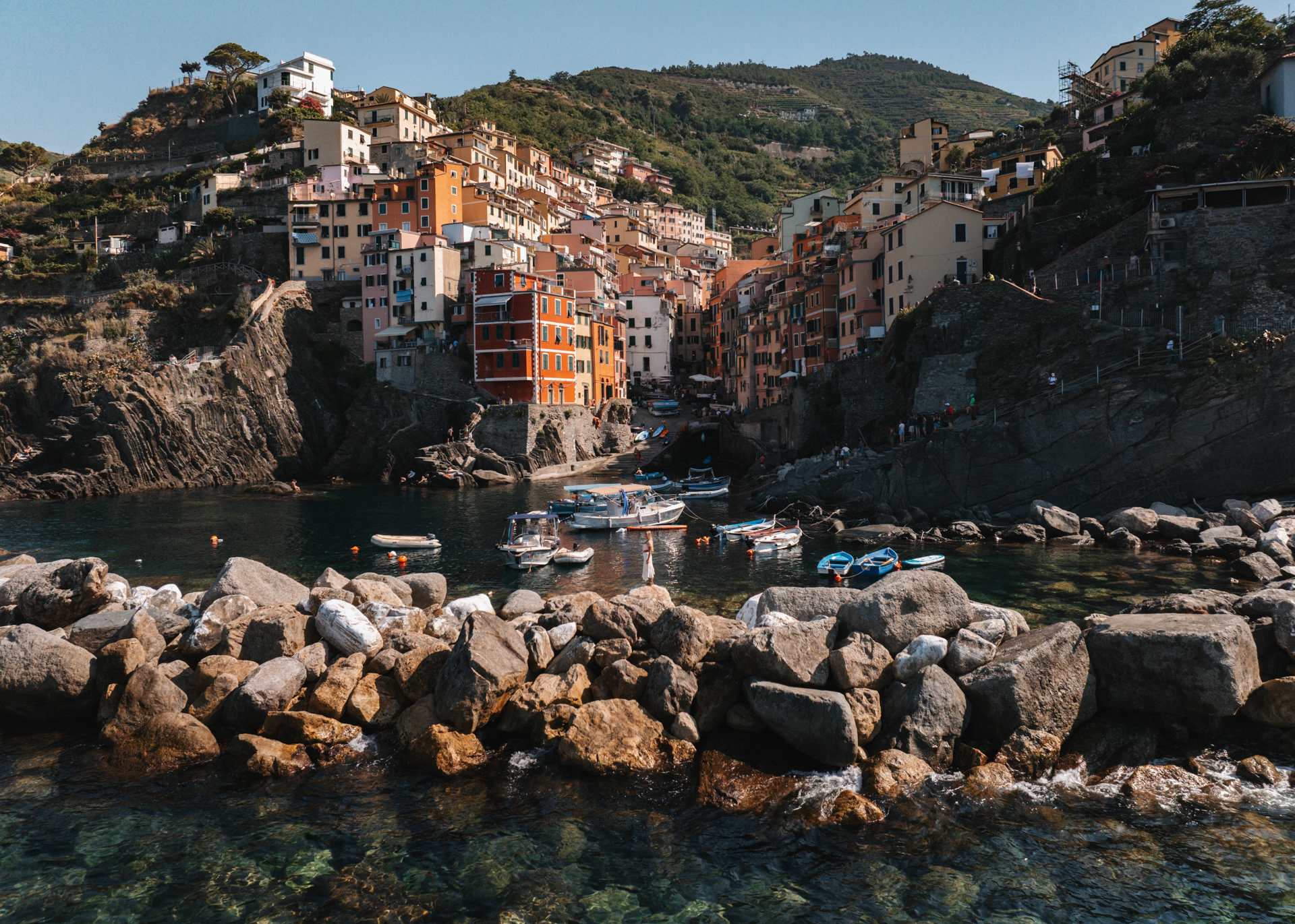 Riomaggiore harbor and colorful village in Cinque Terre, Italy