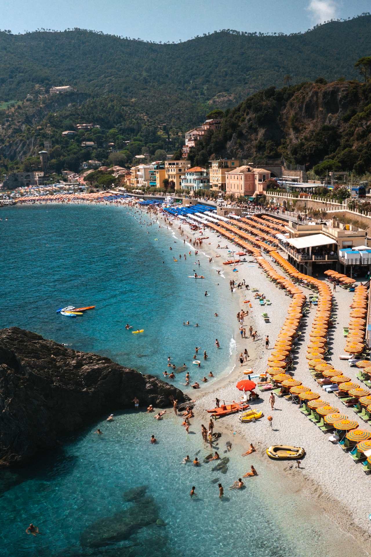 Monterosso beach with colorful umbrellas in Cinque Terre, Italy