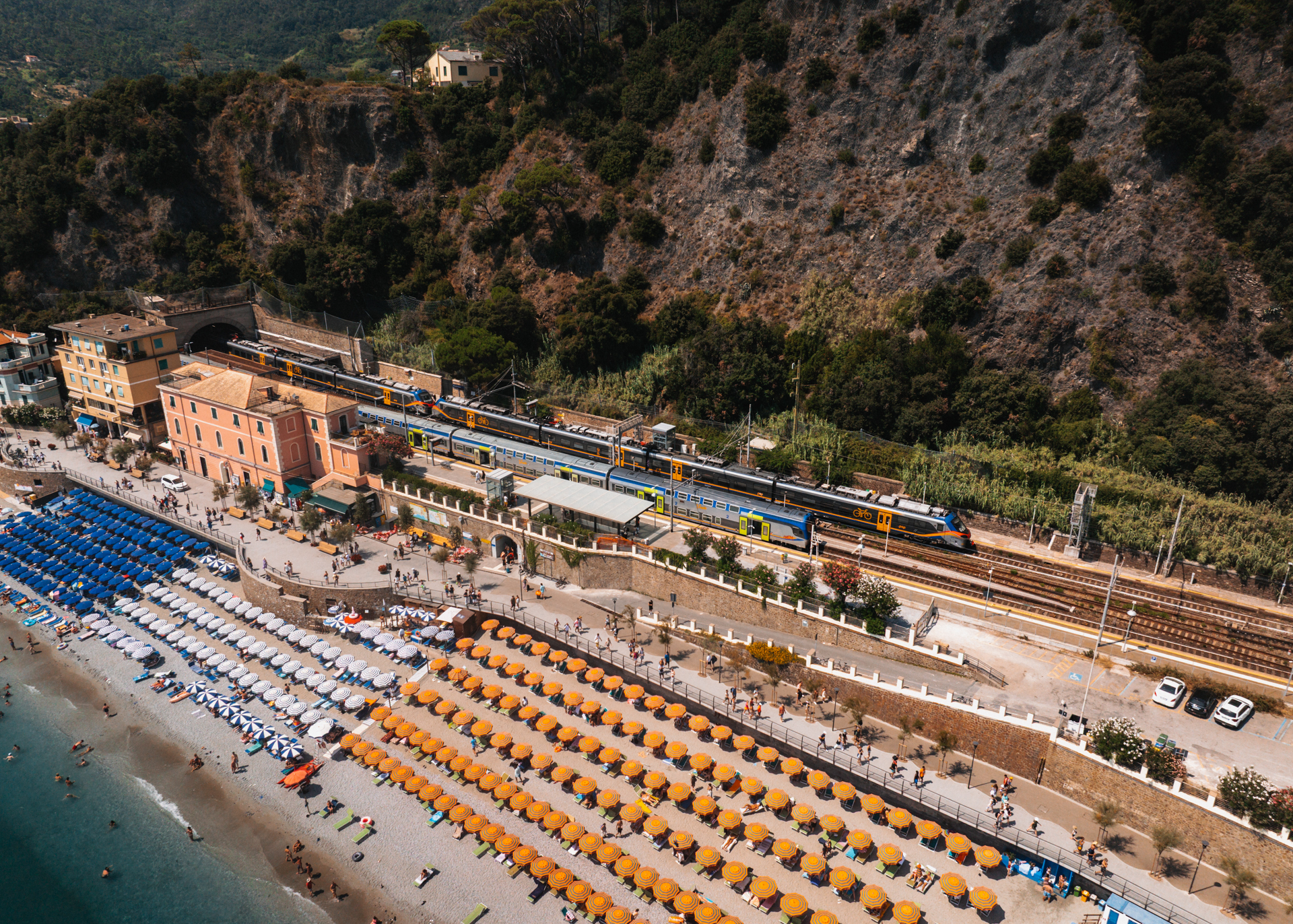 Train beside Monterosso beach in Cinque Terre, Italy