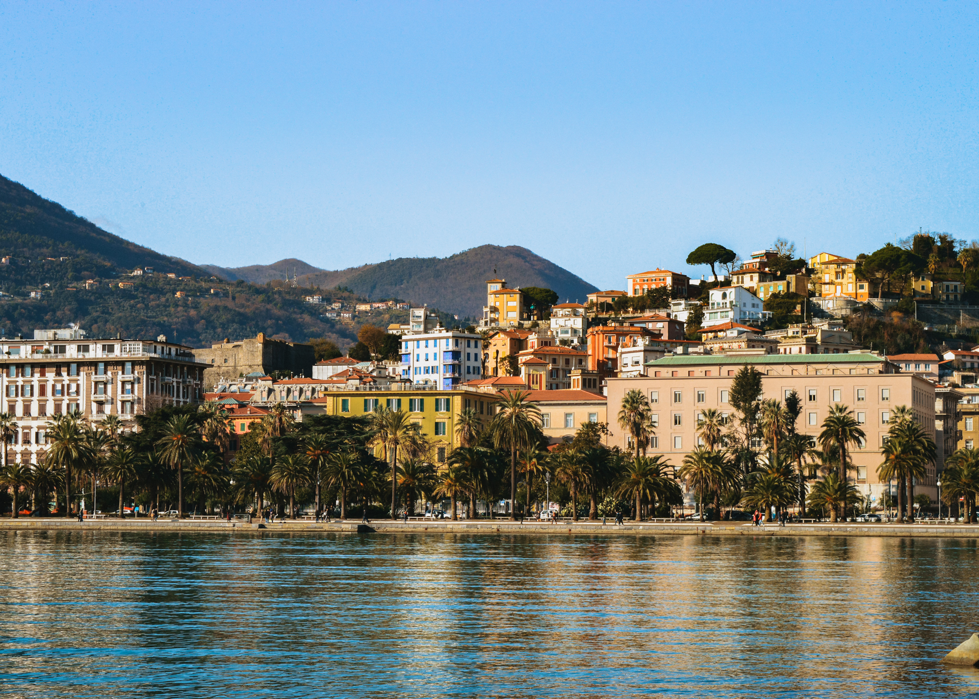 La Spezia waterfront and palm-lined promenade in Italy