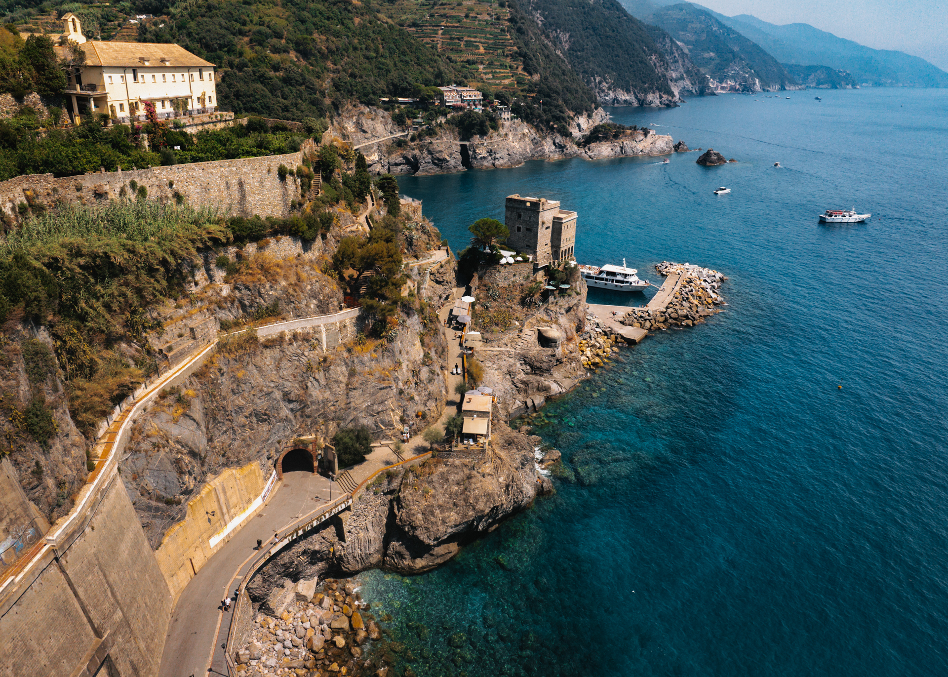 Aerial view of Monterosso coastline and harbor in Cinque Terre, Italy