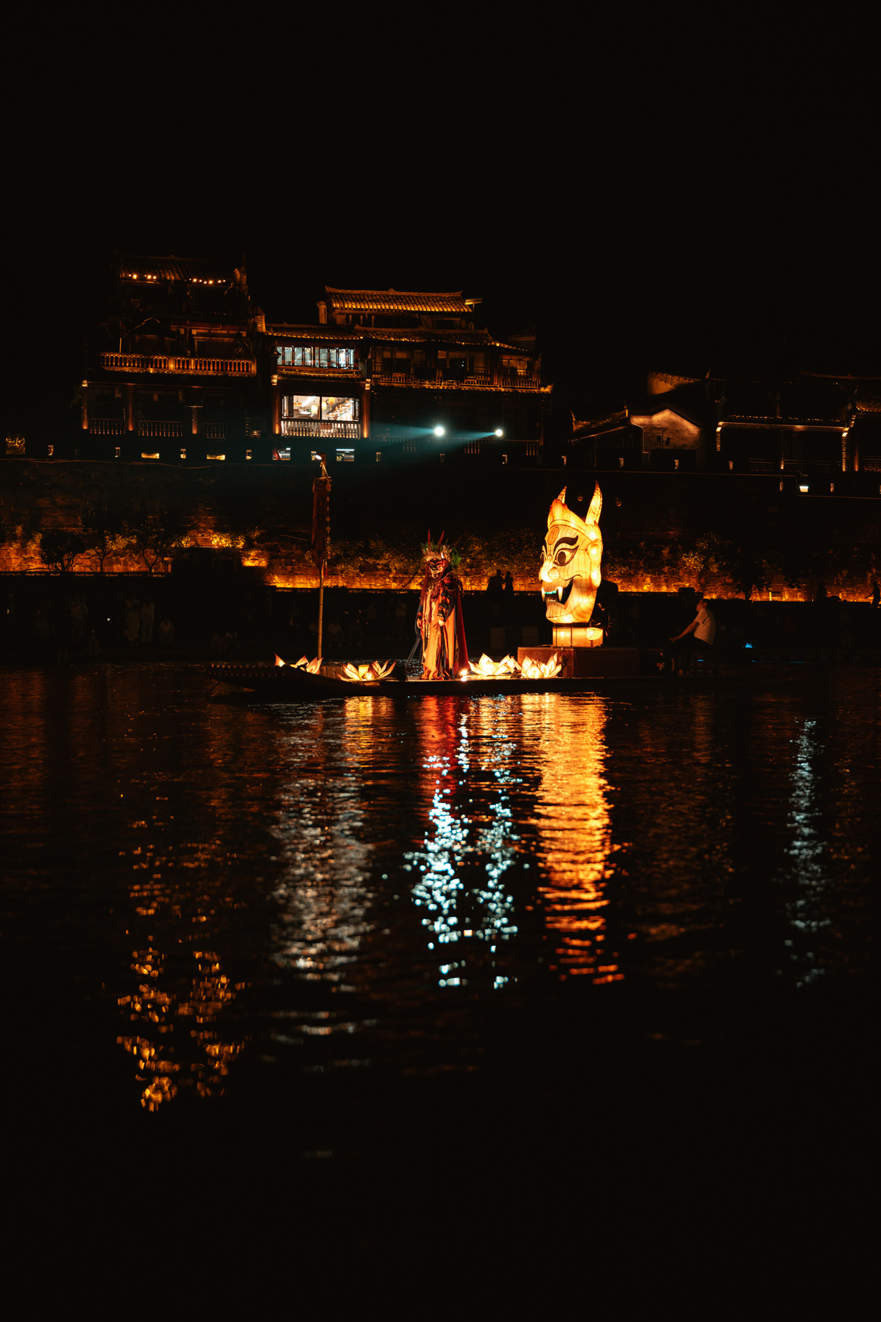 Night performance on the Tuojiang River in Fenghuang Ancient Town, China