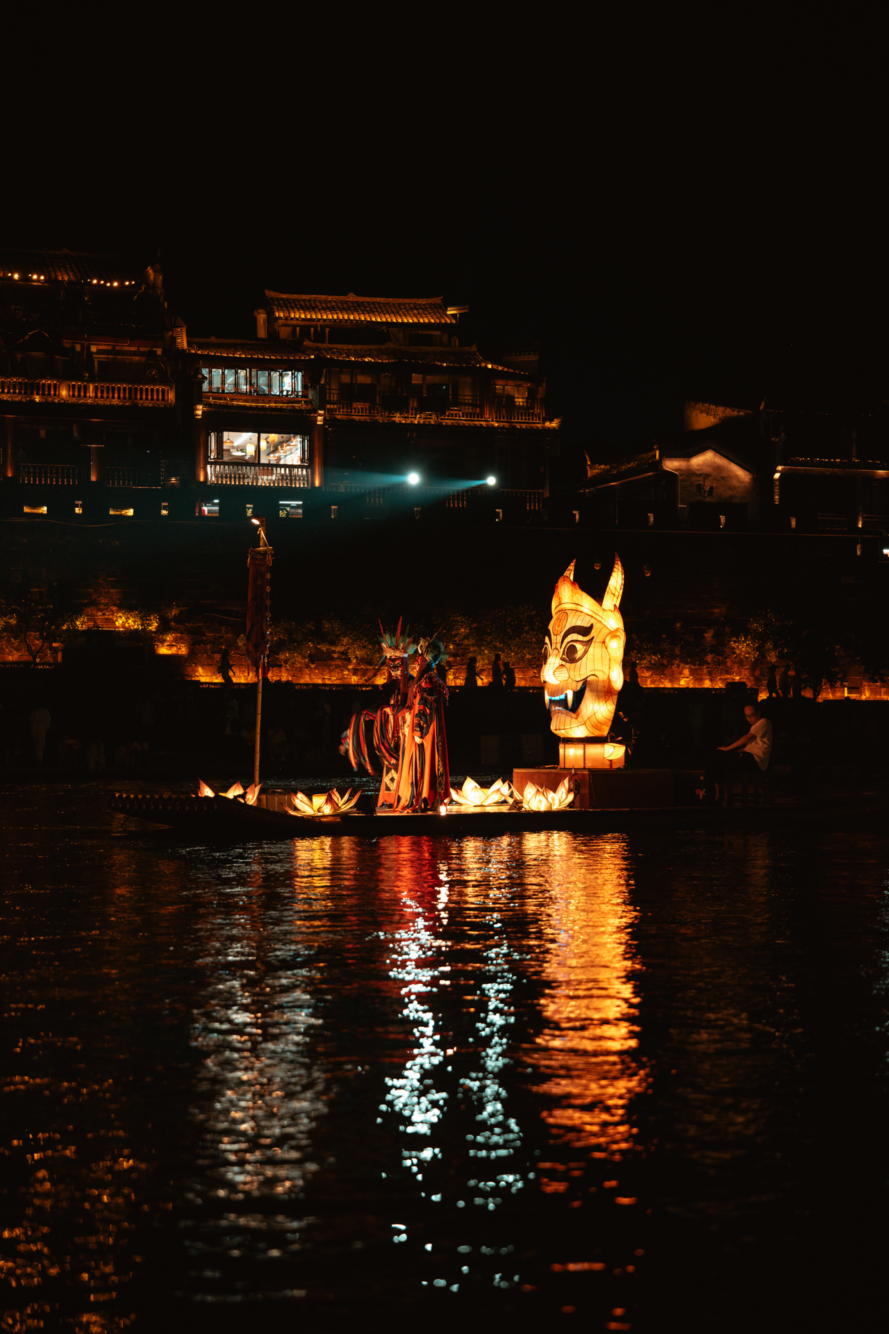 Night performance on the Tuojiang River in Fenghuang Ancient Town, China