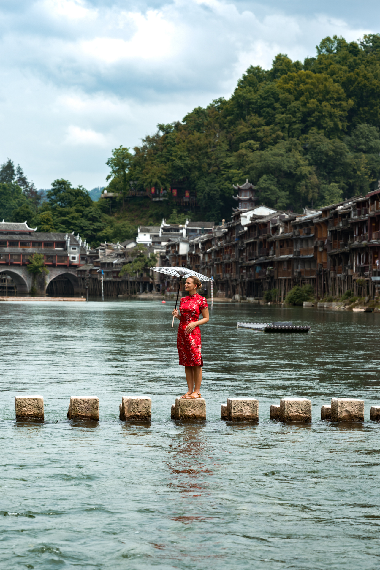 Stepping stones across the Tuojiang River in Fenghuang Ancient Town, China