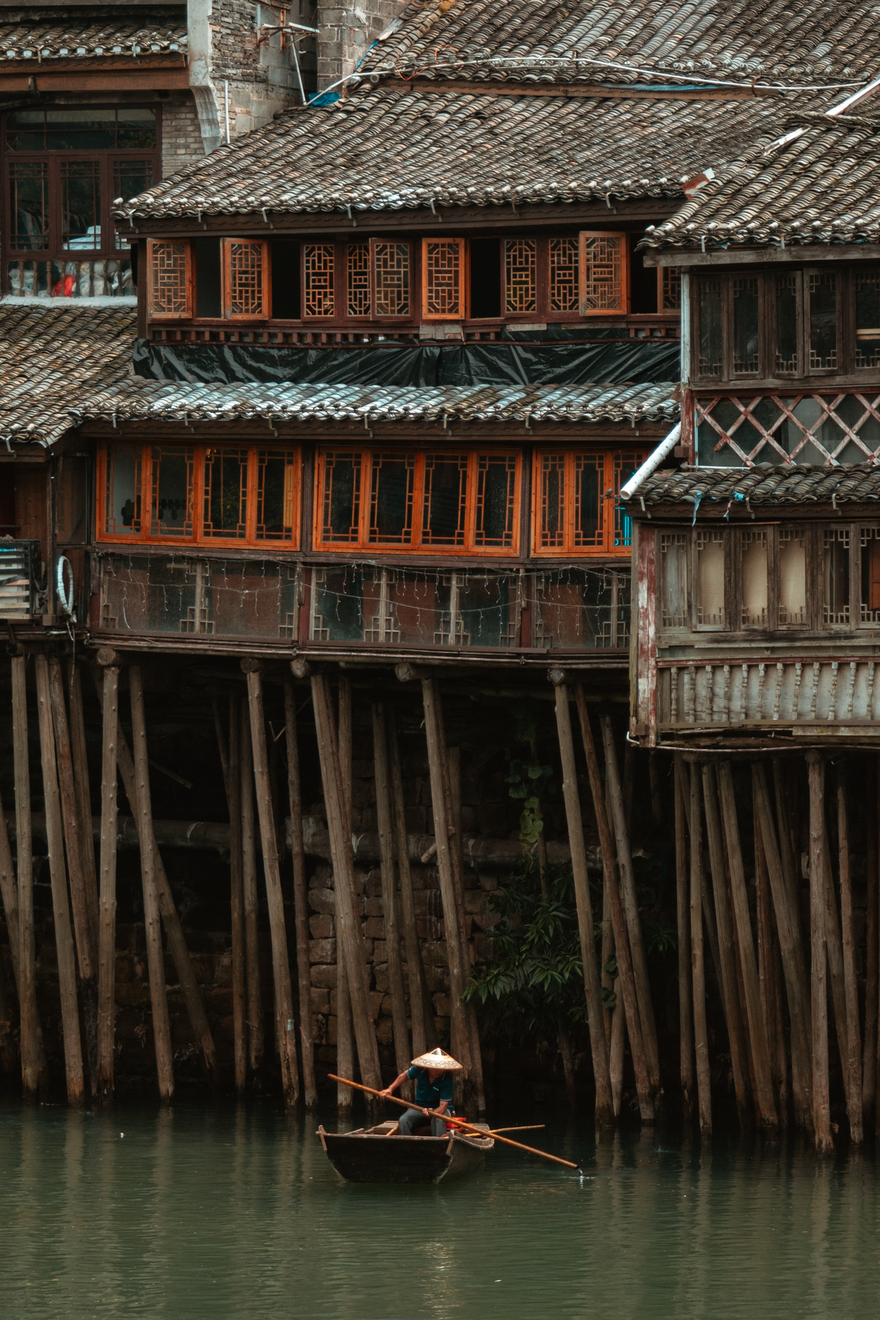 Traditional stilt houses along the Tuojiang River in Fenghuang, China