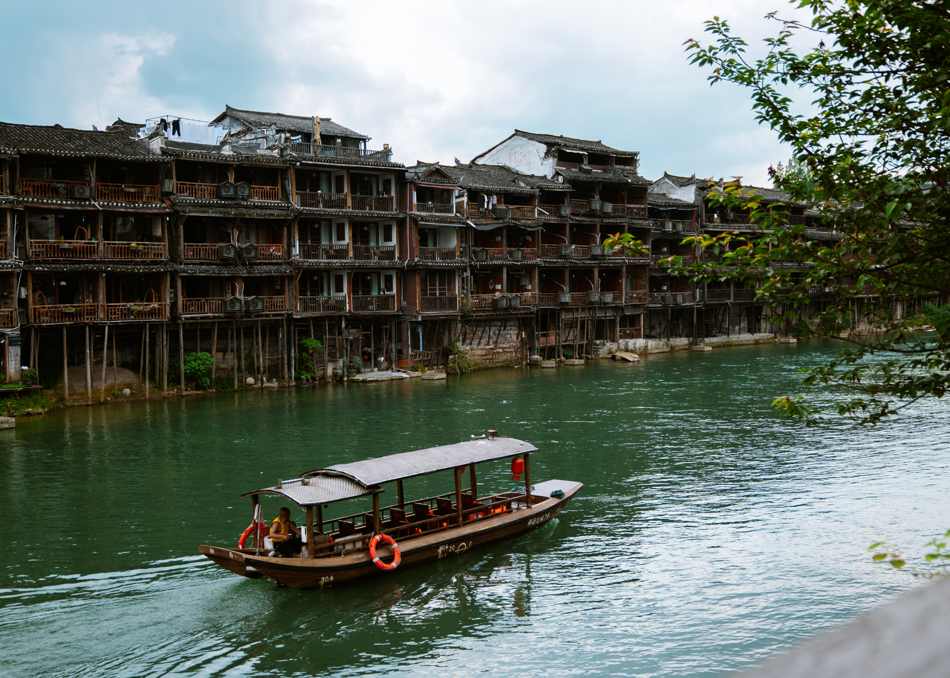 Traditional boat on the Tuojiang River in Fenghuang Ancient Town, China
