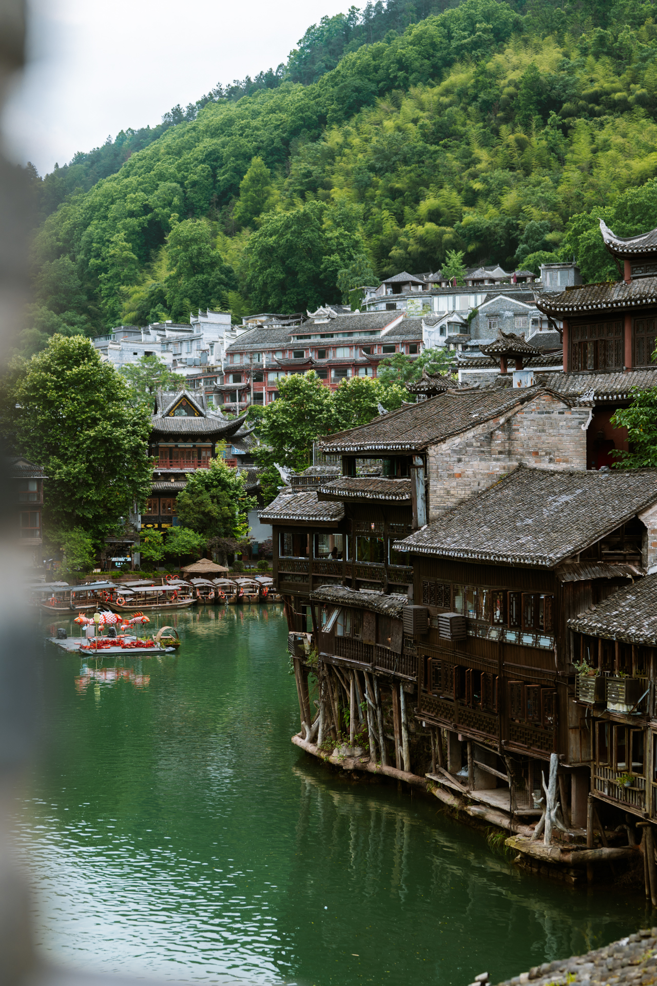 Traditional stilt houses along the Tuojiang River in Fenghuang Ancient Town, China