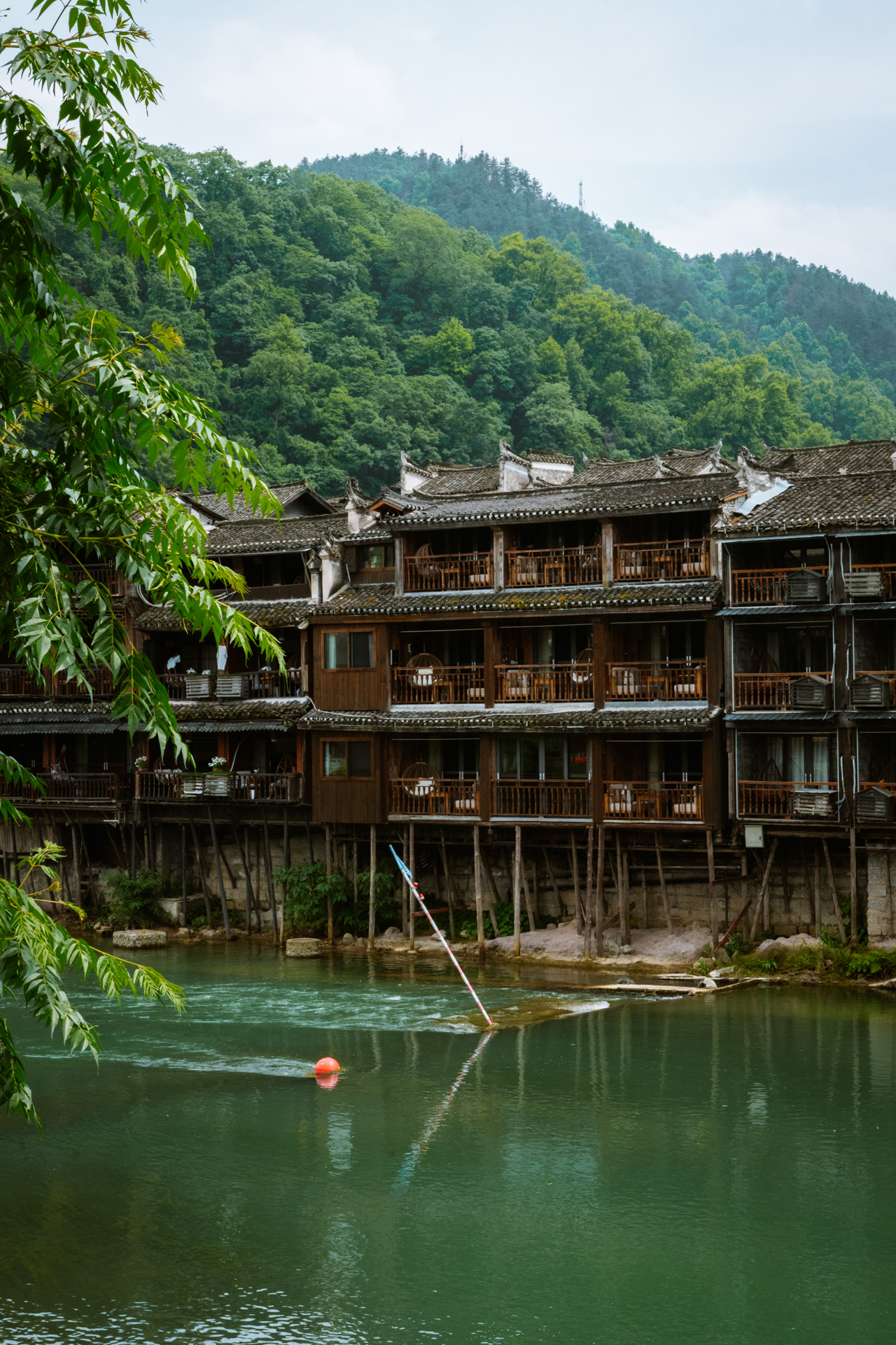 Traditional stilt houses along the Tuojiang River in Fenghuang Ancient Town, China