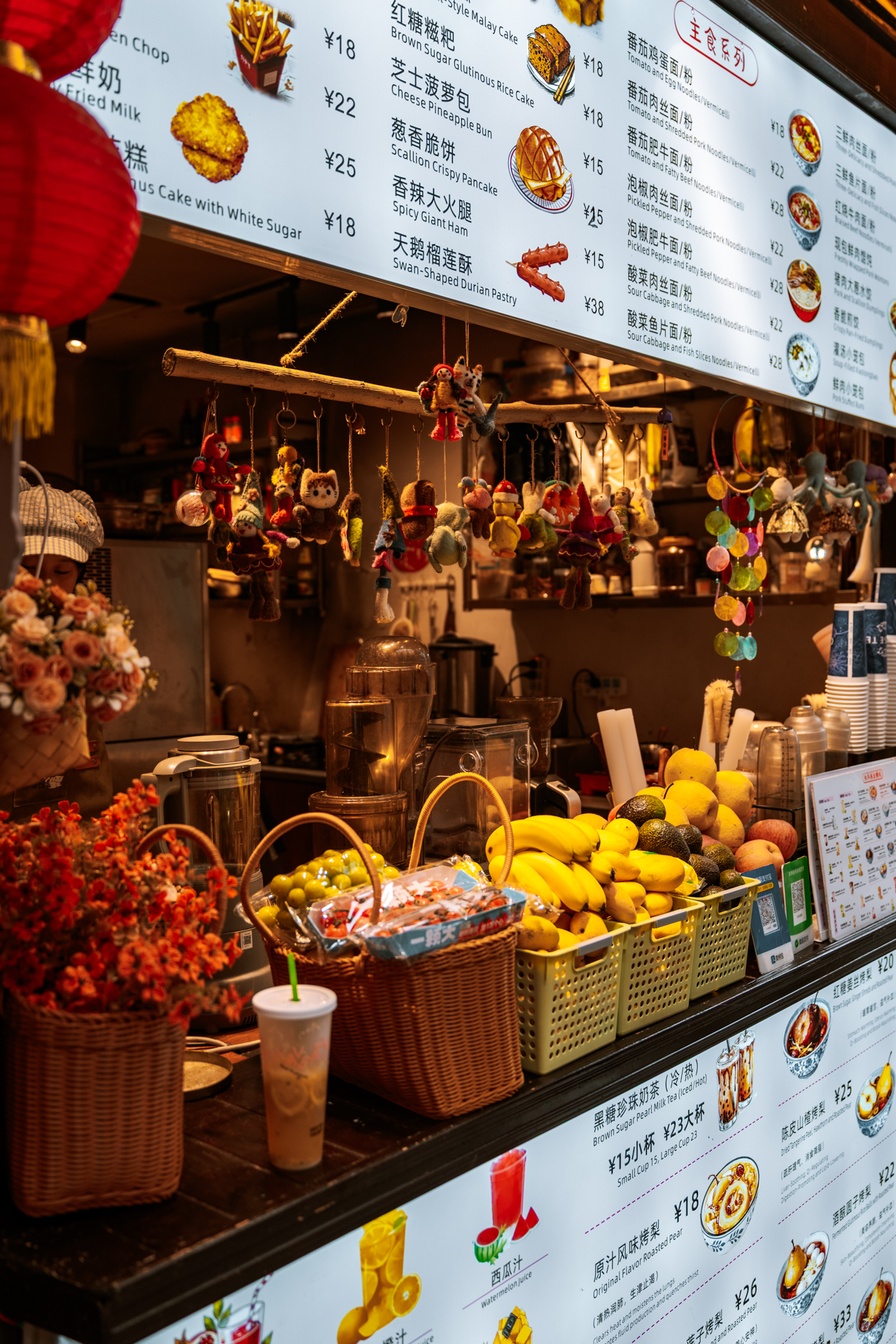 Street food and drink stall with local snacks in Furong Ancient Town, China.