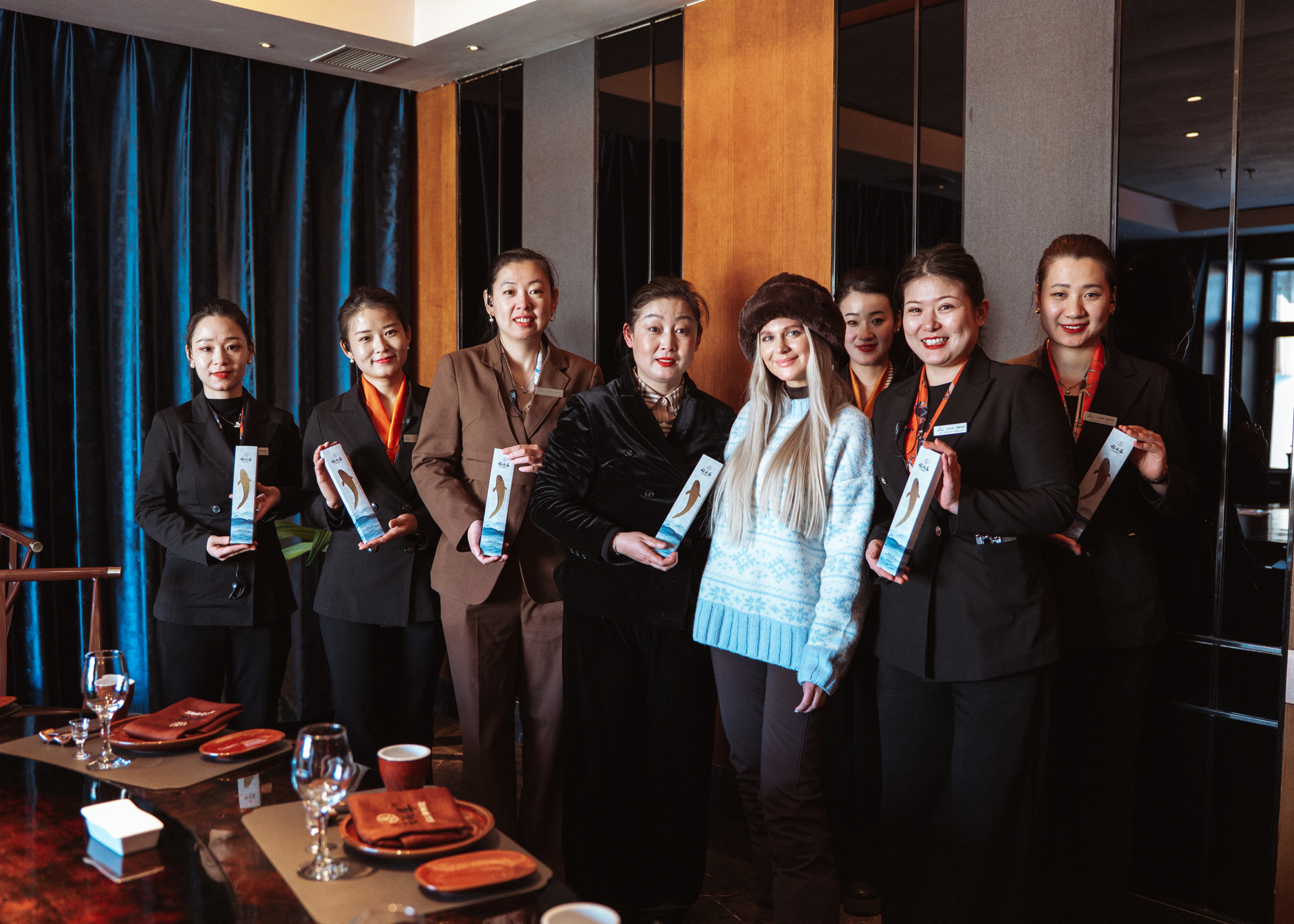 Group photo with restaurant staff during a dining experience in Harbin, China.