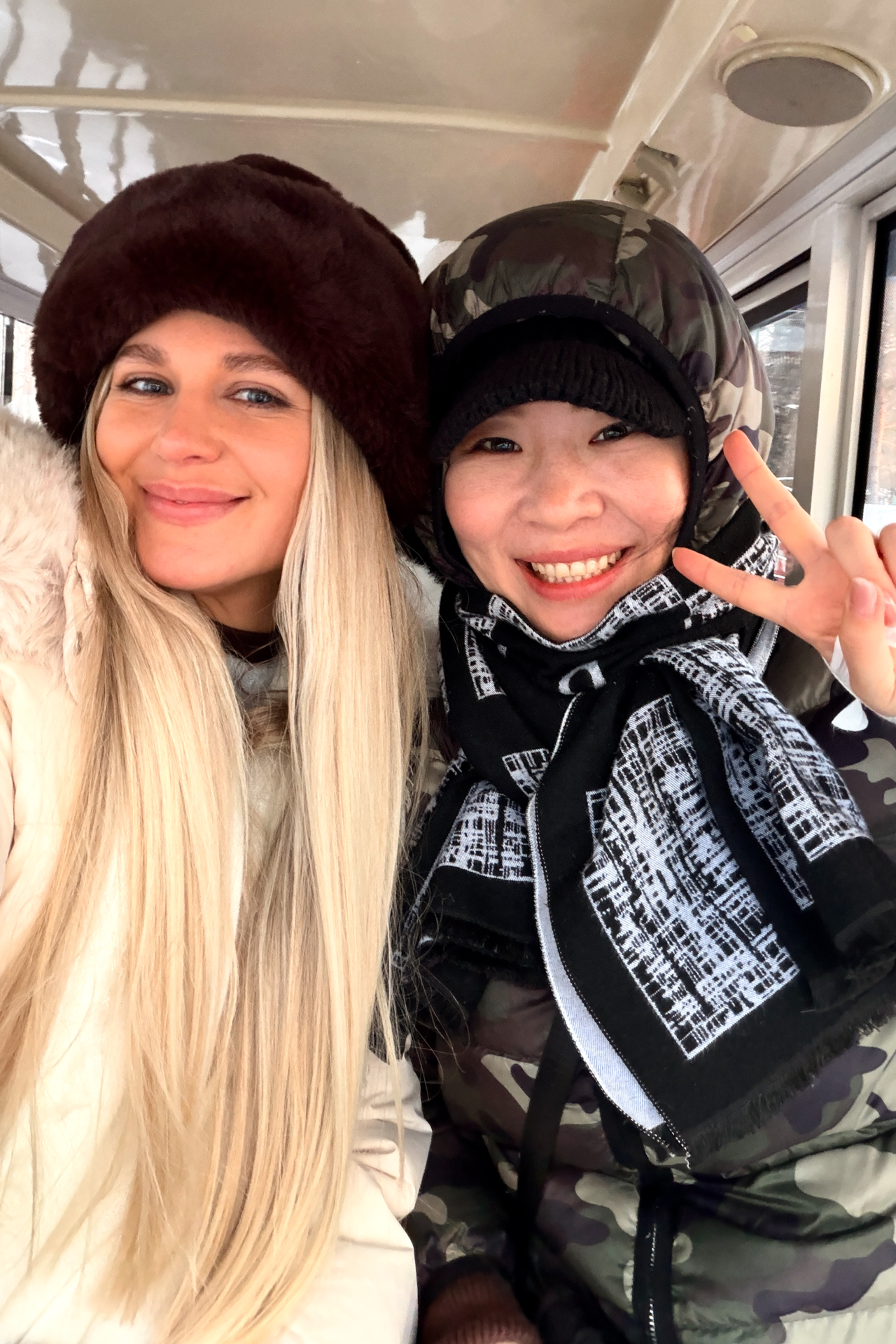 Selfie with a local woman while bundled up for Harbin’s freezing winter weather.