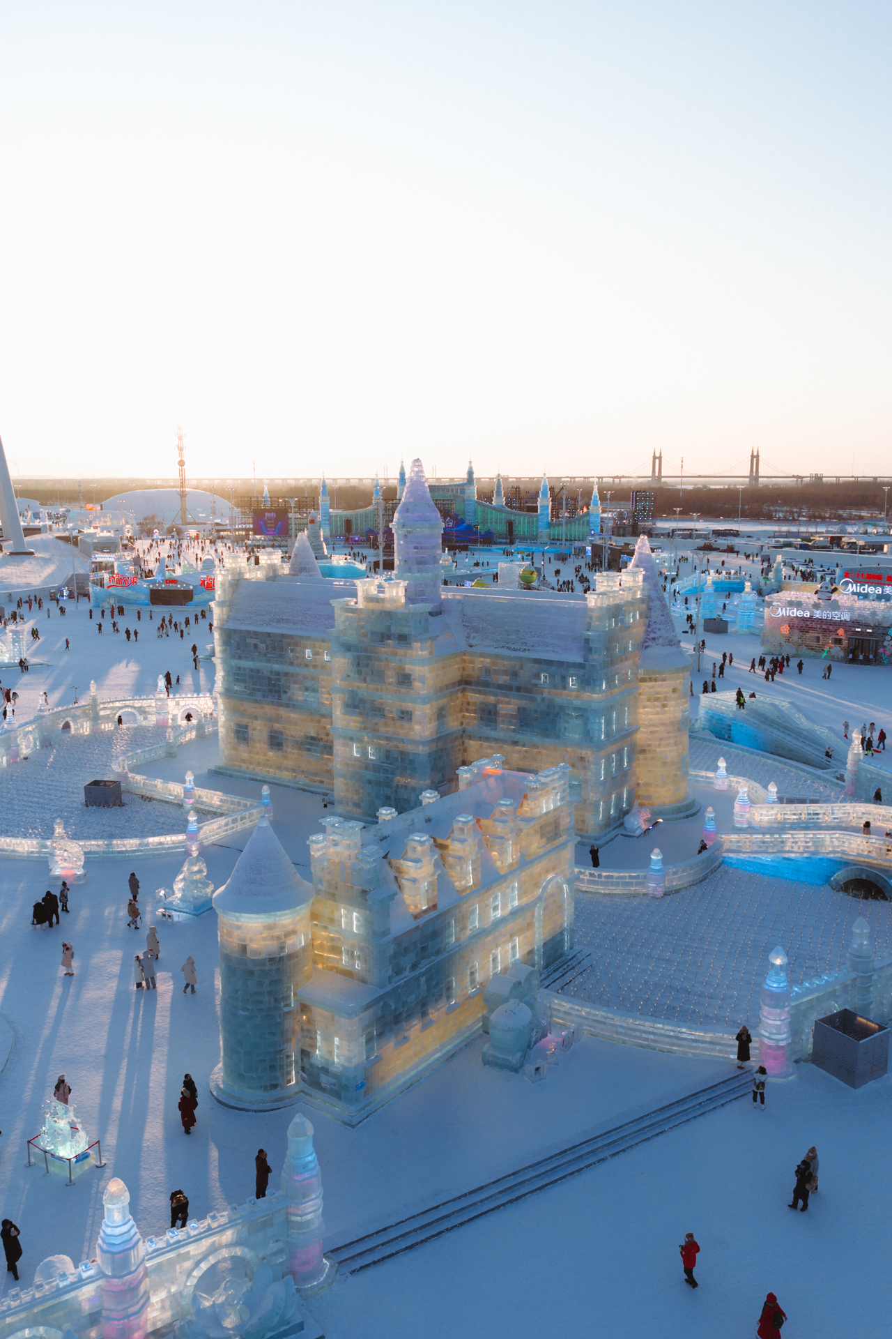Ice castle and illuminated sculptures at Harbin Ice and Snow World in winter.
