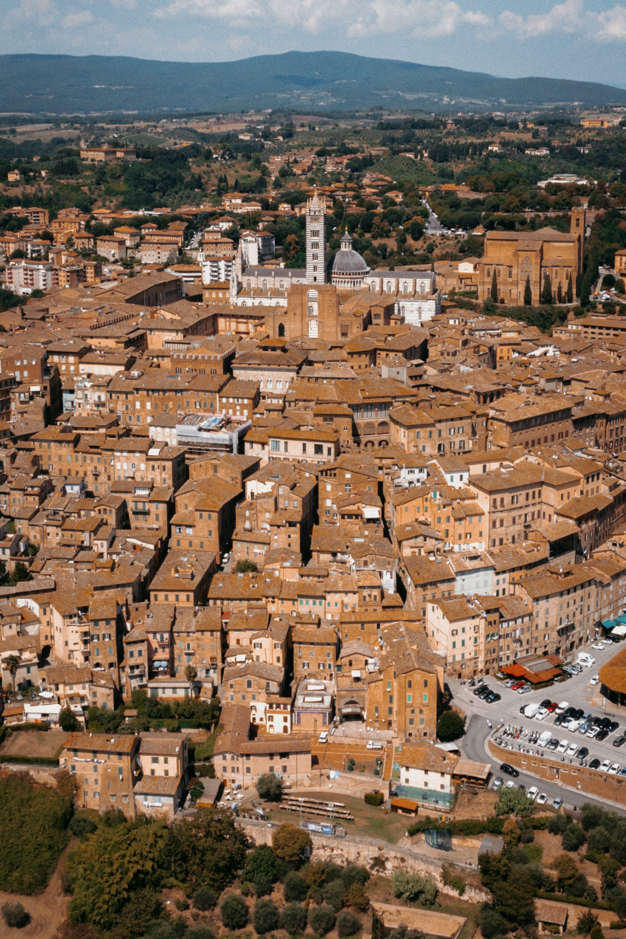 Panoramic view over Siena’s historic rooftops and cathedral