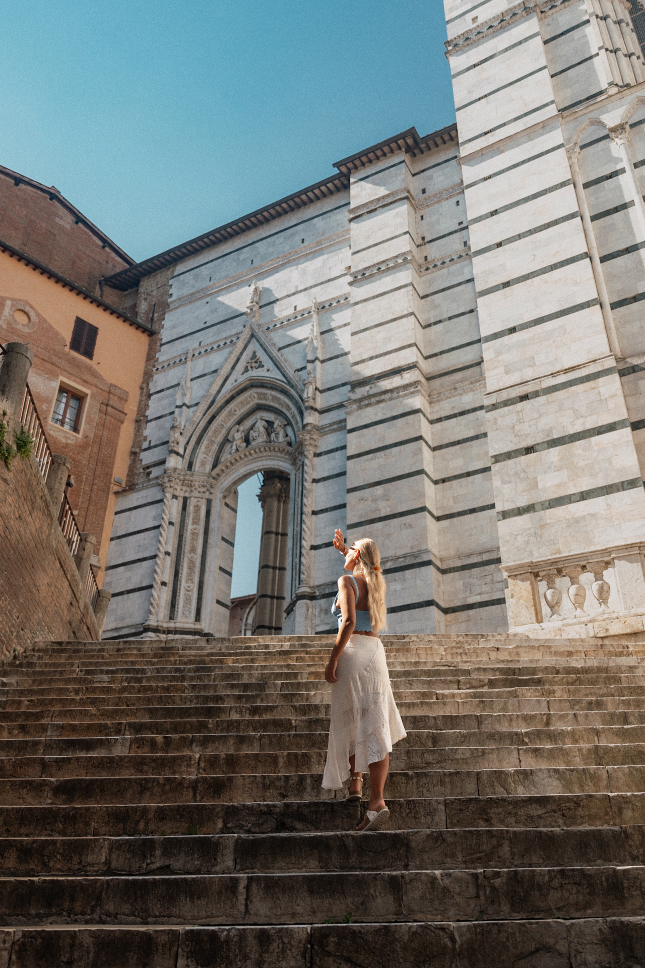 Walking up the steps beside Siena Cathedral in Tuscany, Italy