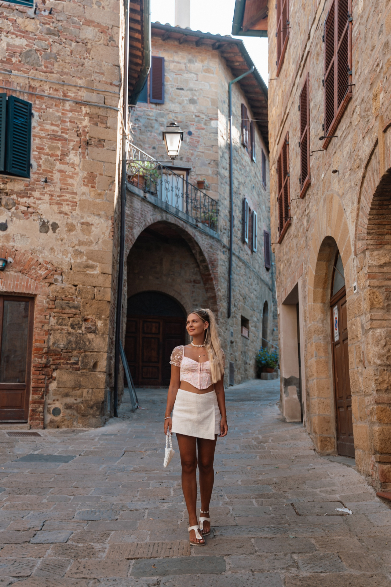 Walking through the historic stone streets of Monticchiello, Tuscany
