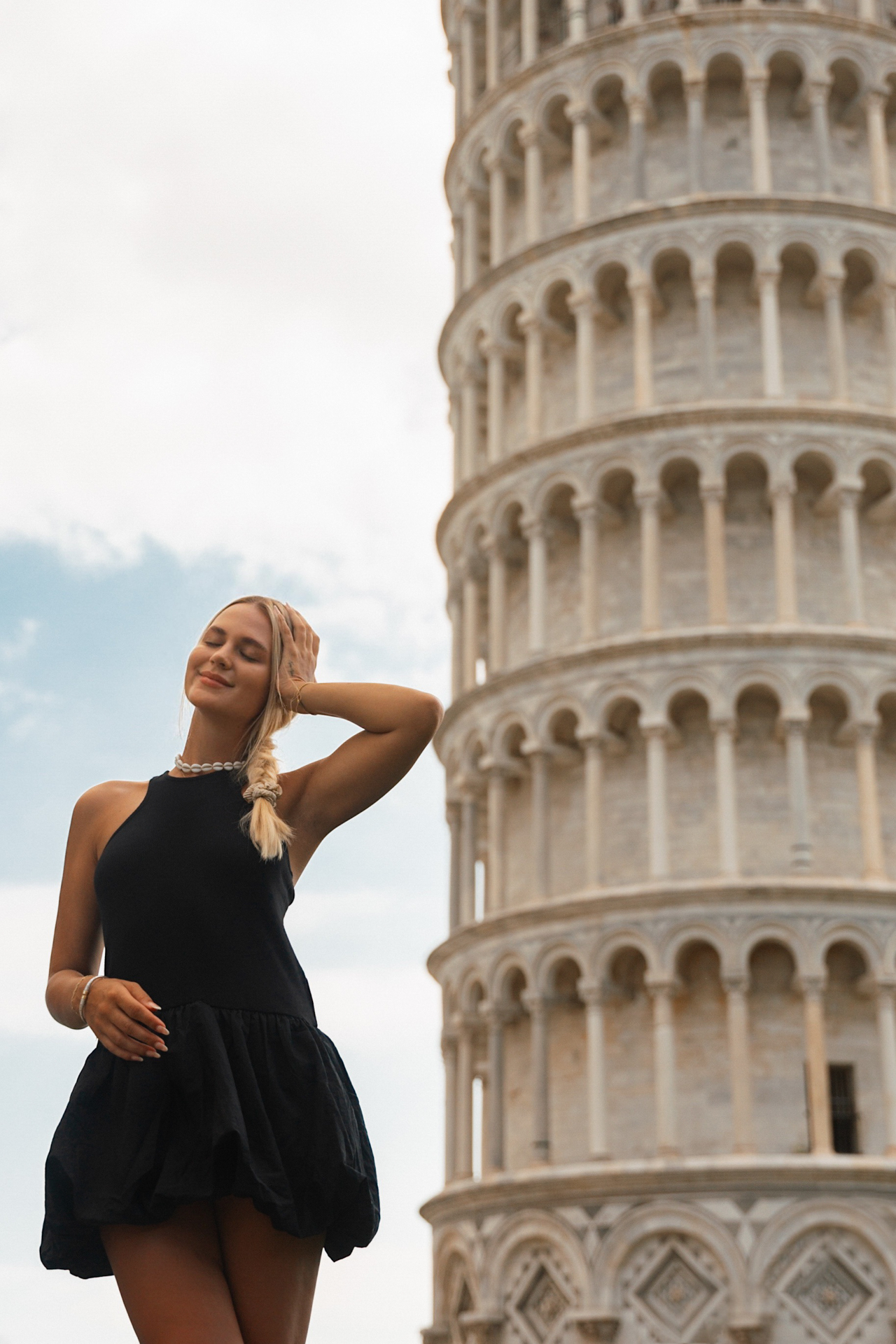 Posing beside the Leaning Tower of Pisa in Tuscany