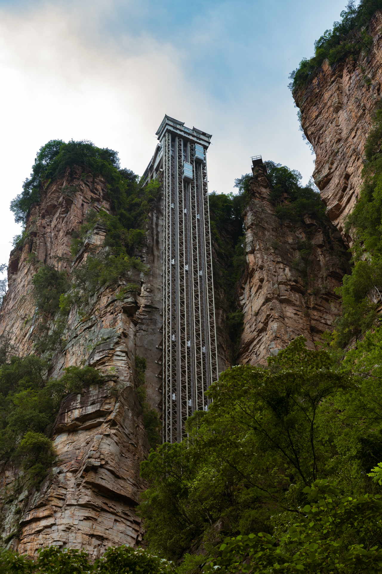 Bailong Elevator rising between the sandstone cliffs of Zhangjiajie National Forest Park.