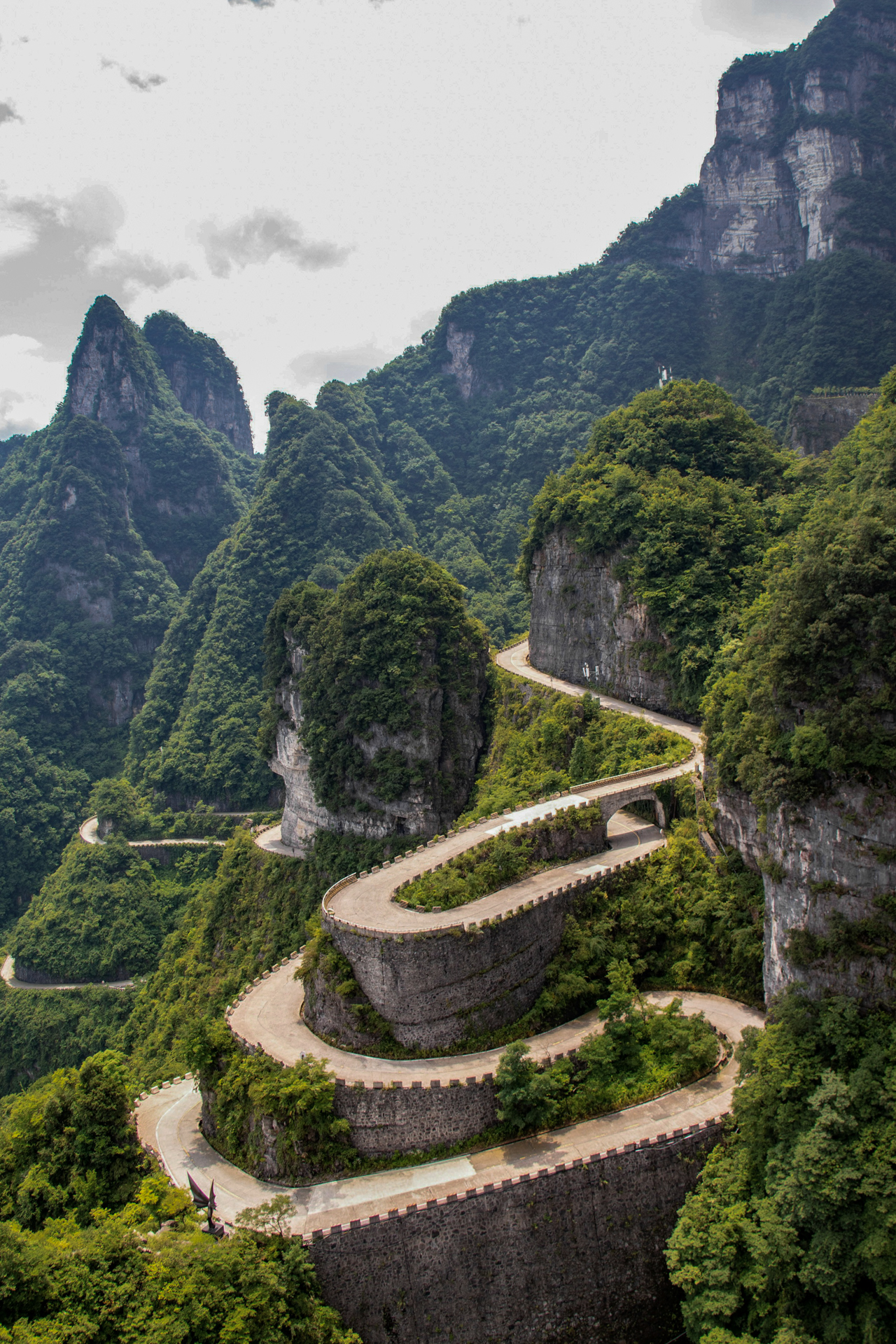 Winding 99 Bends road through the mountains of Tianmen Mountain in Zhangjiajie, China.