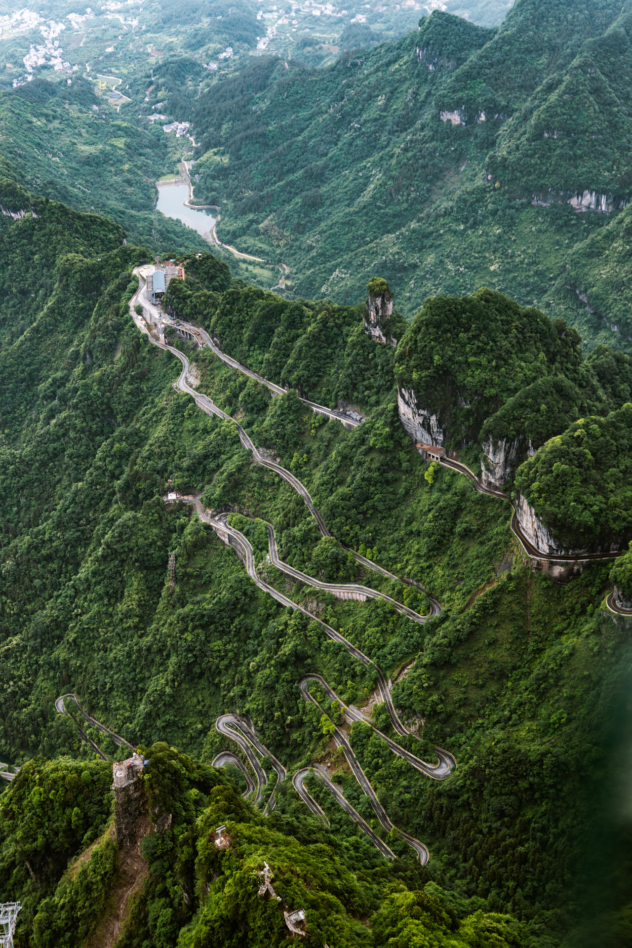 Winding 99 Bends road through the lush mountains of Tianmen Mountain, Zhangjiajie, China.