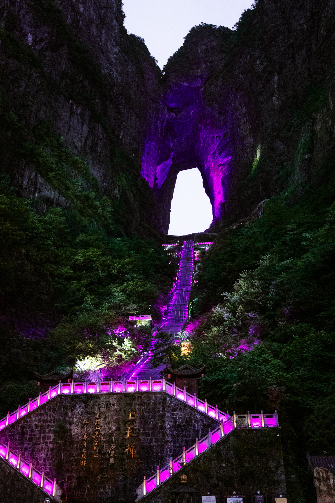 Heaven’s Gate illuminated in purple at night on Tianmen Mountain, Zhangjiajie, China.